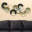 Metal Levan Abstract Circle Wall Decor With Clock featuring navy blue, black and gold fan-wheel discs, large contemporary wall art by Vedas Homes