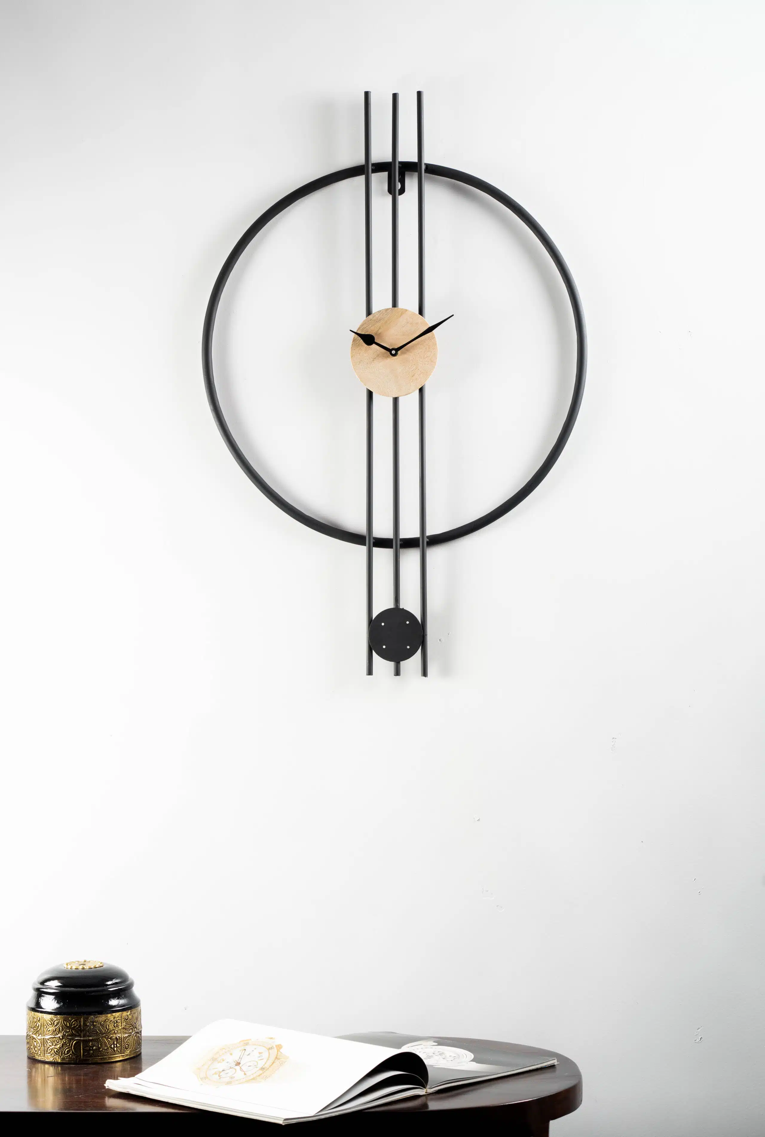 Skylar Modern Silent Wall Clock with black metal frame, walnut centre and pendulum design for living room decor