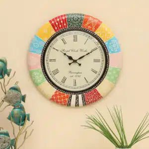 Galleria Handpainted Wooden Wall Clock with folk-art patchwork frame in multicolour panels and decorative Roman numeral dial by Vedas Homes