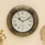 Zeya Heritage Wooden Polished and Brass Metal Fit Wall Clock with ornate floral frame and Roman numeral dial by Vedas Homes