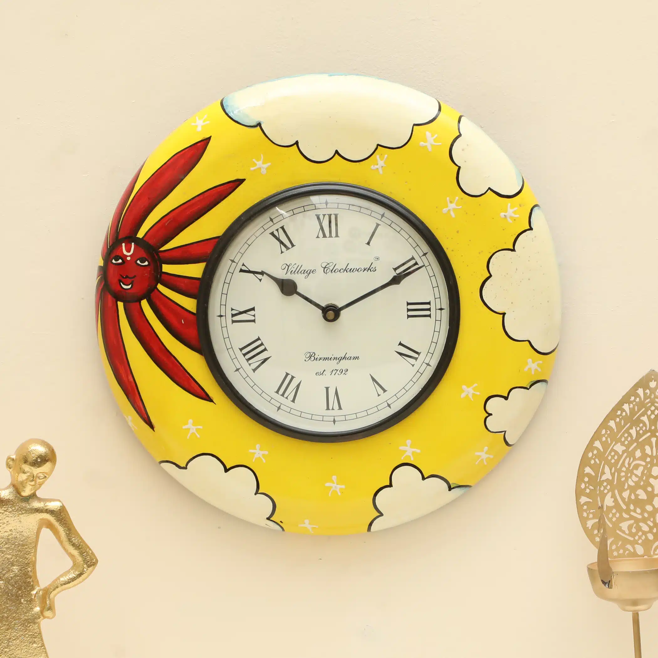 Siya Handpainted Wooden Wall Clock with folk-art sun face, red rays and white clouds on saffron yellow frame by Vedas Homes