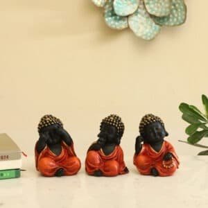 Orange Polyresin Stella Monk Buddha God Idol Figurine Table Decor Showpiece (Set of 3)